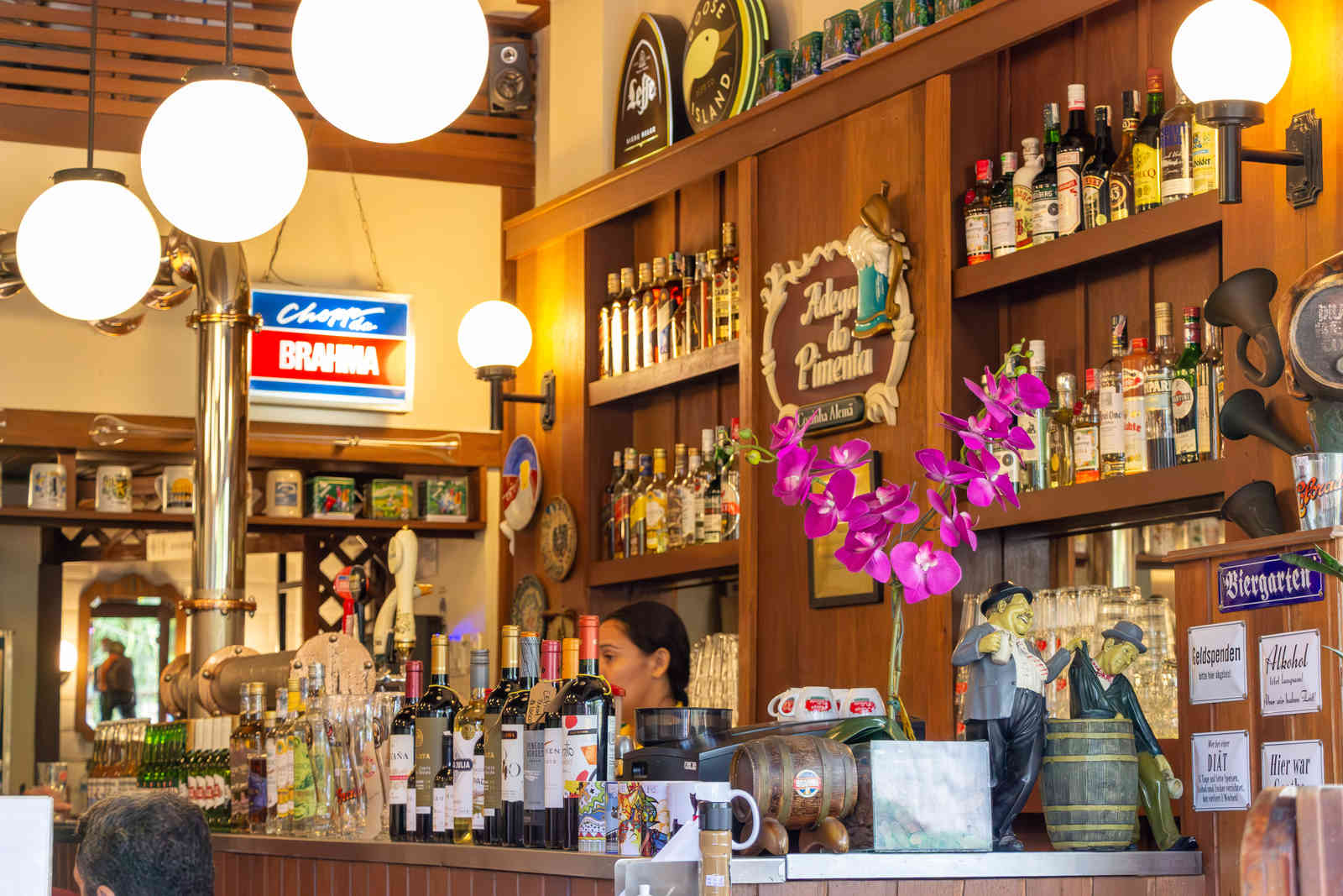 The bar counter and German decorations inside Adega do Pimenta