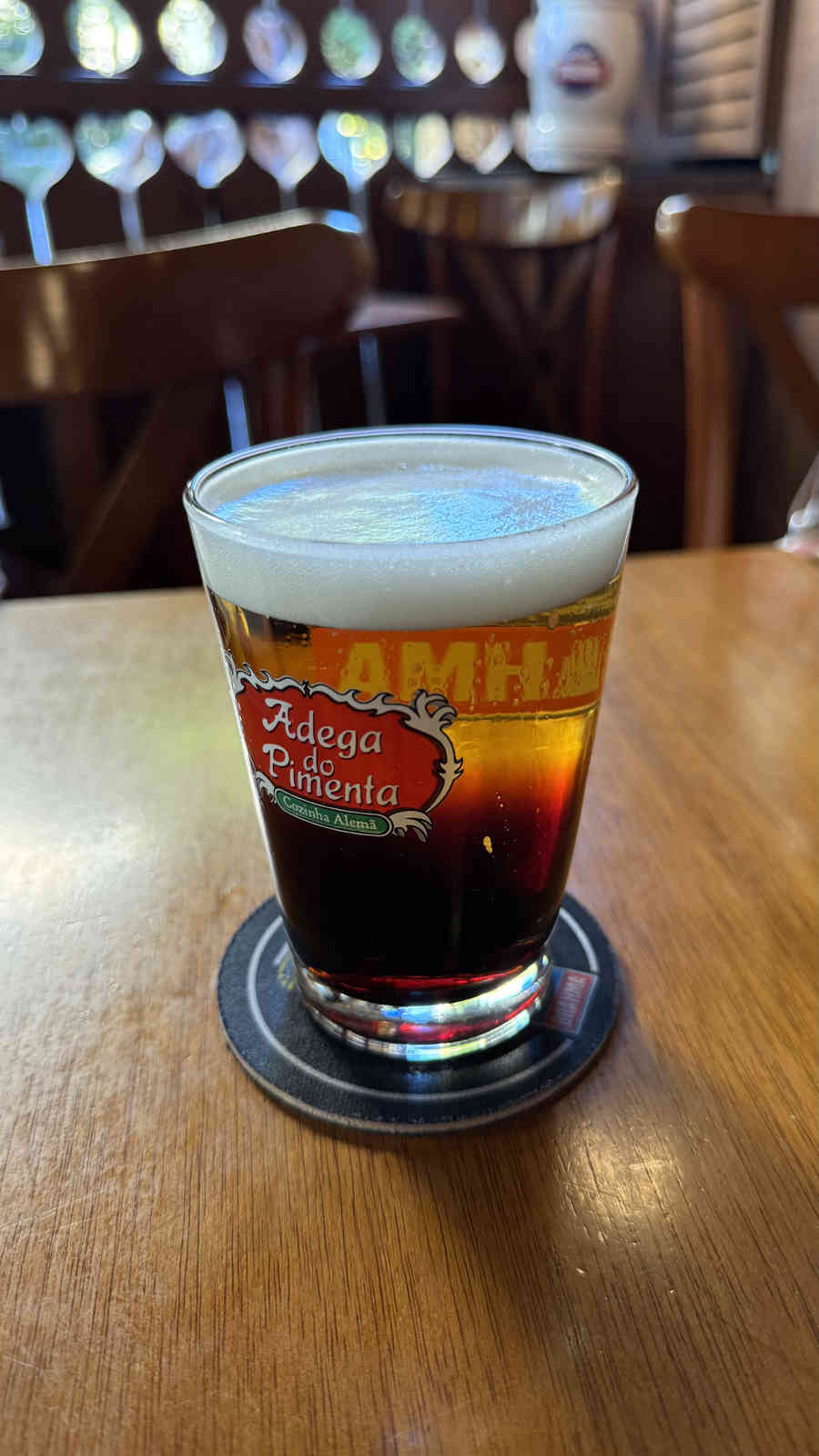 Pale and dark beer poured in separate layers at Adega do Pimenta