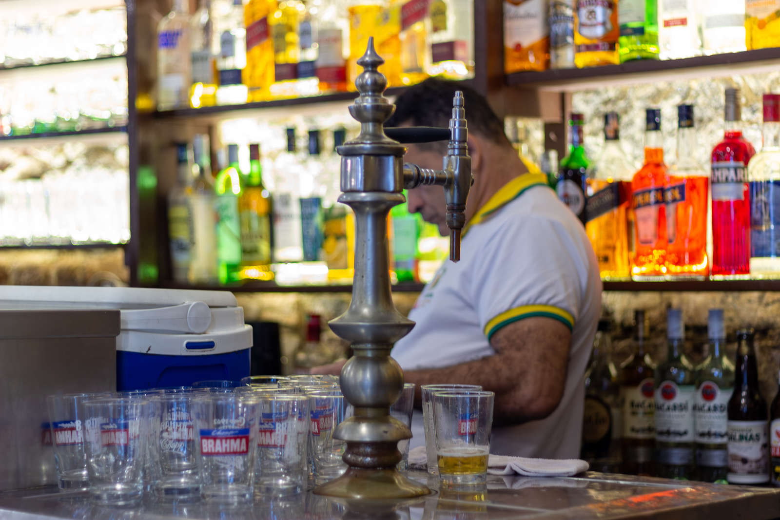The historic bronze beer tap on the counter at Bar Brasil