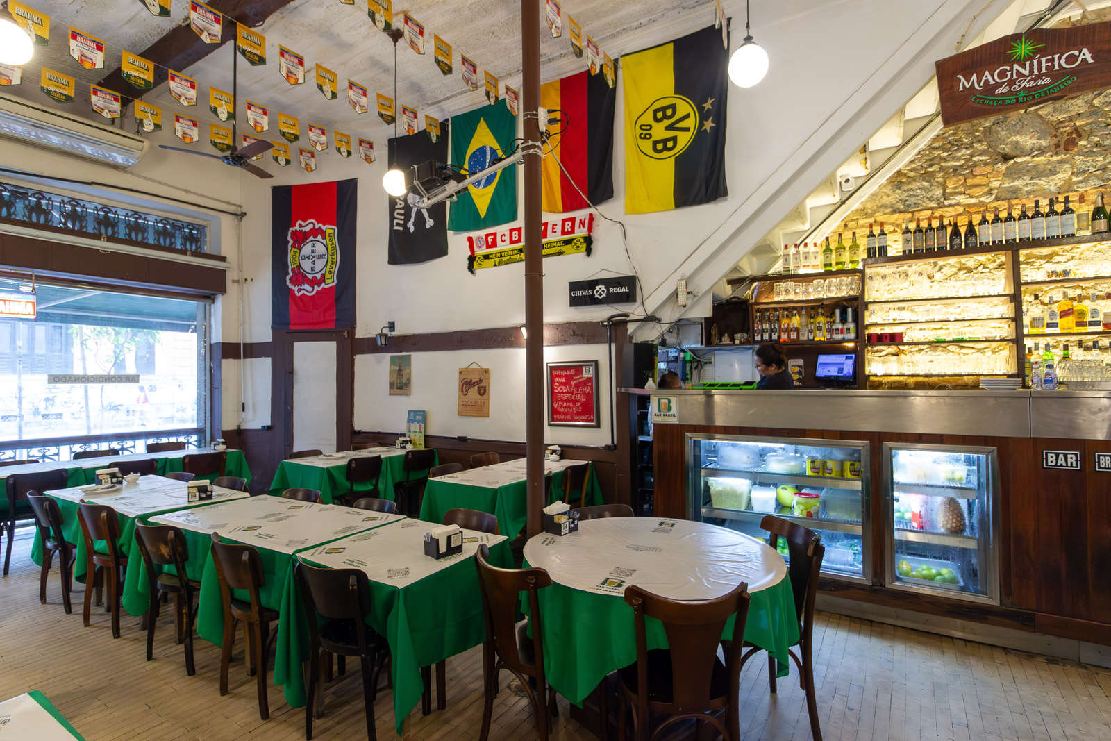 The interior of Bar Brasil with its counter and German flags