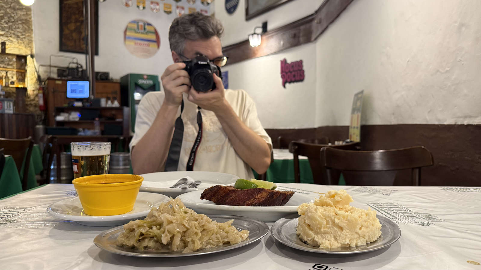 The author photographing smoked kassler and side dishes at Bar Brasil