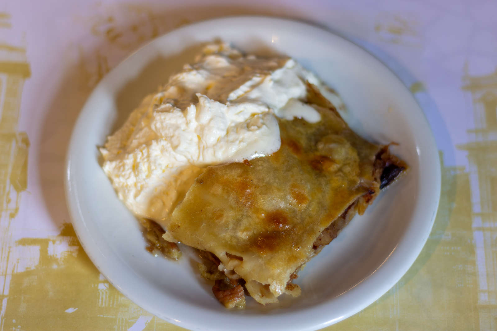 A serving of apple strudel with homemade whipped cream at Bar Ernesto