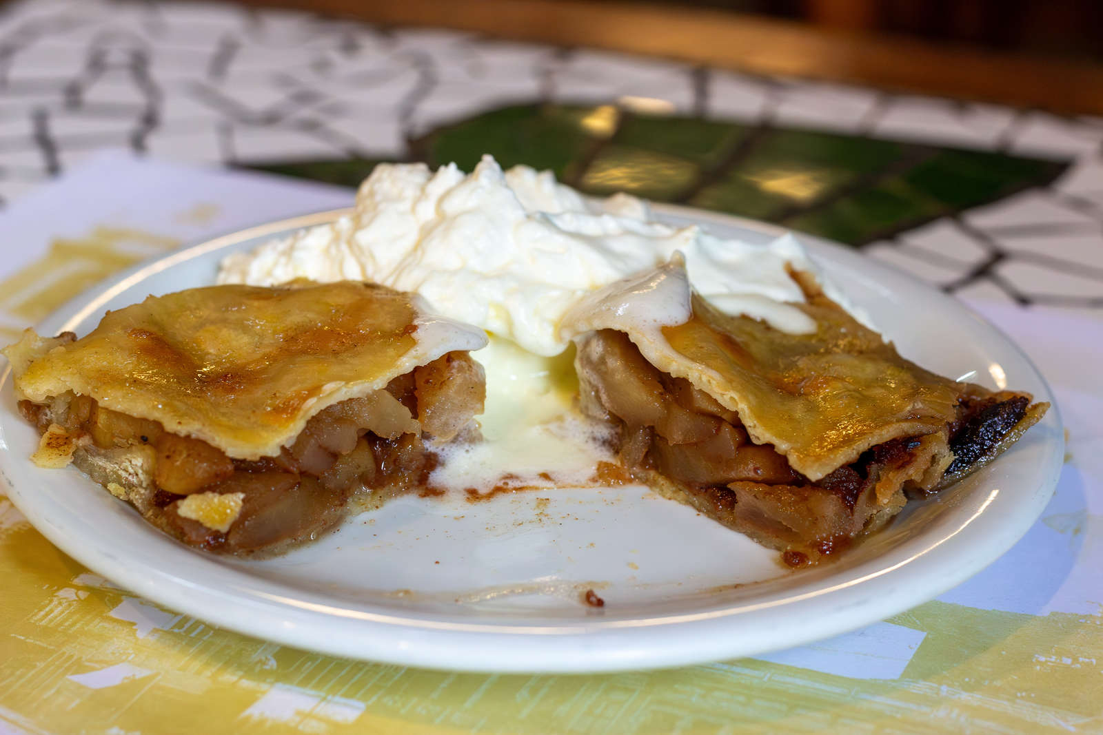 Apple strudel cut open to show the apple and cinnamon filling at Bar Ernesto