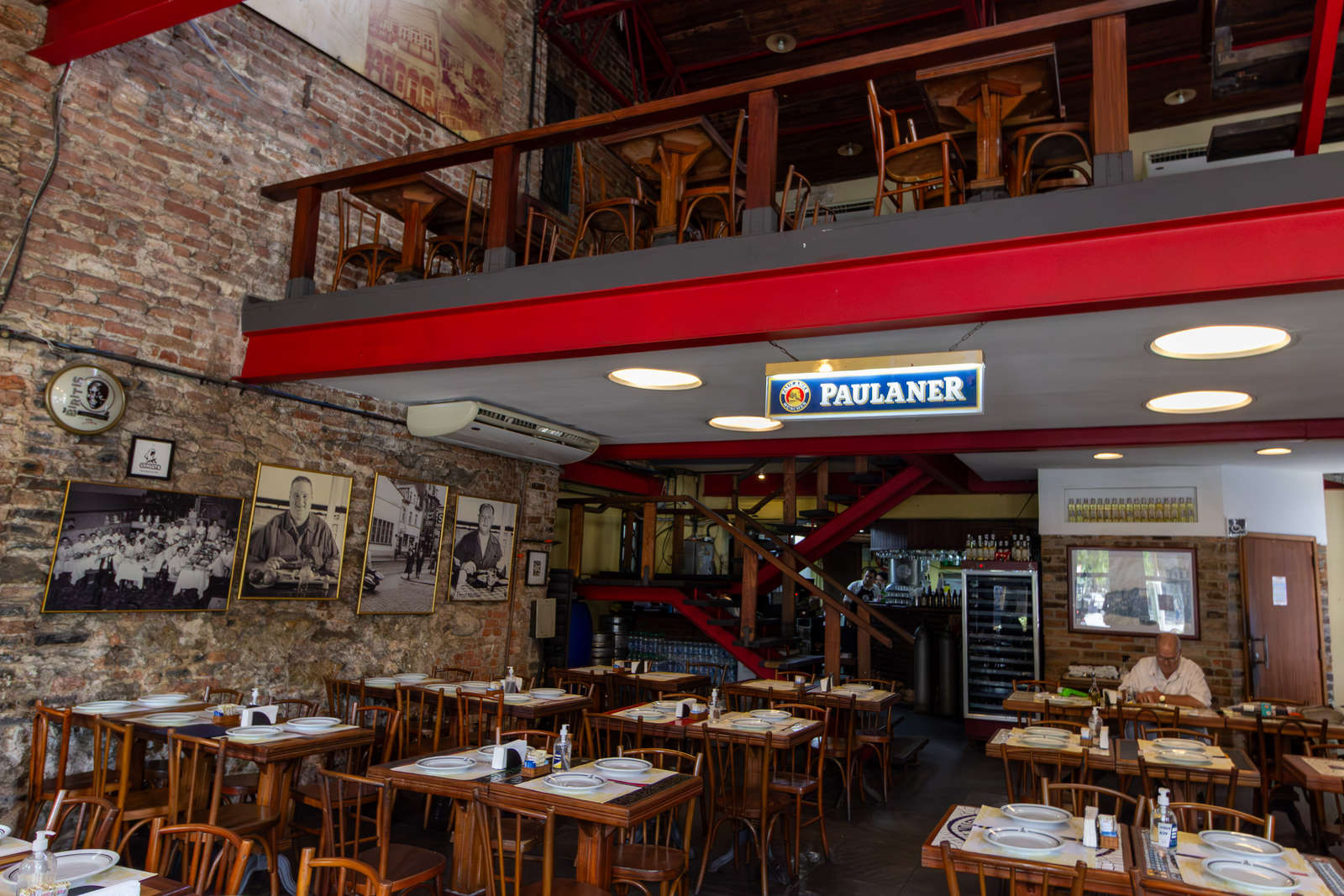 The interior of Bar Ernesto in Lapa with family photographs on the walls