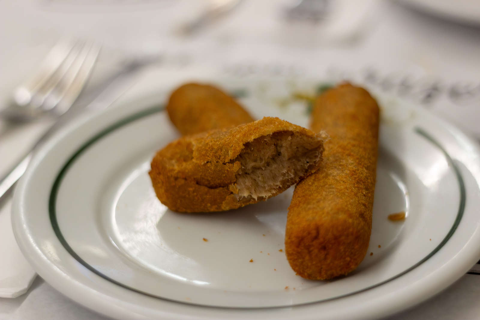 A Casa Urich croquette cut open to show its meat filling