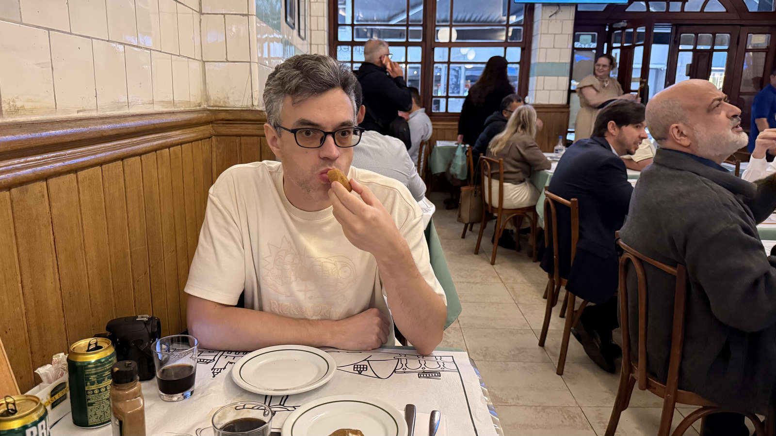 The author trying a meat croquette at Casa Urich