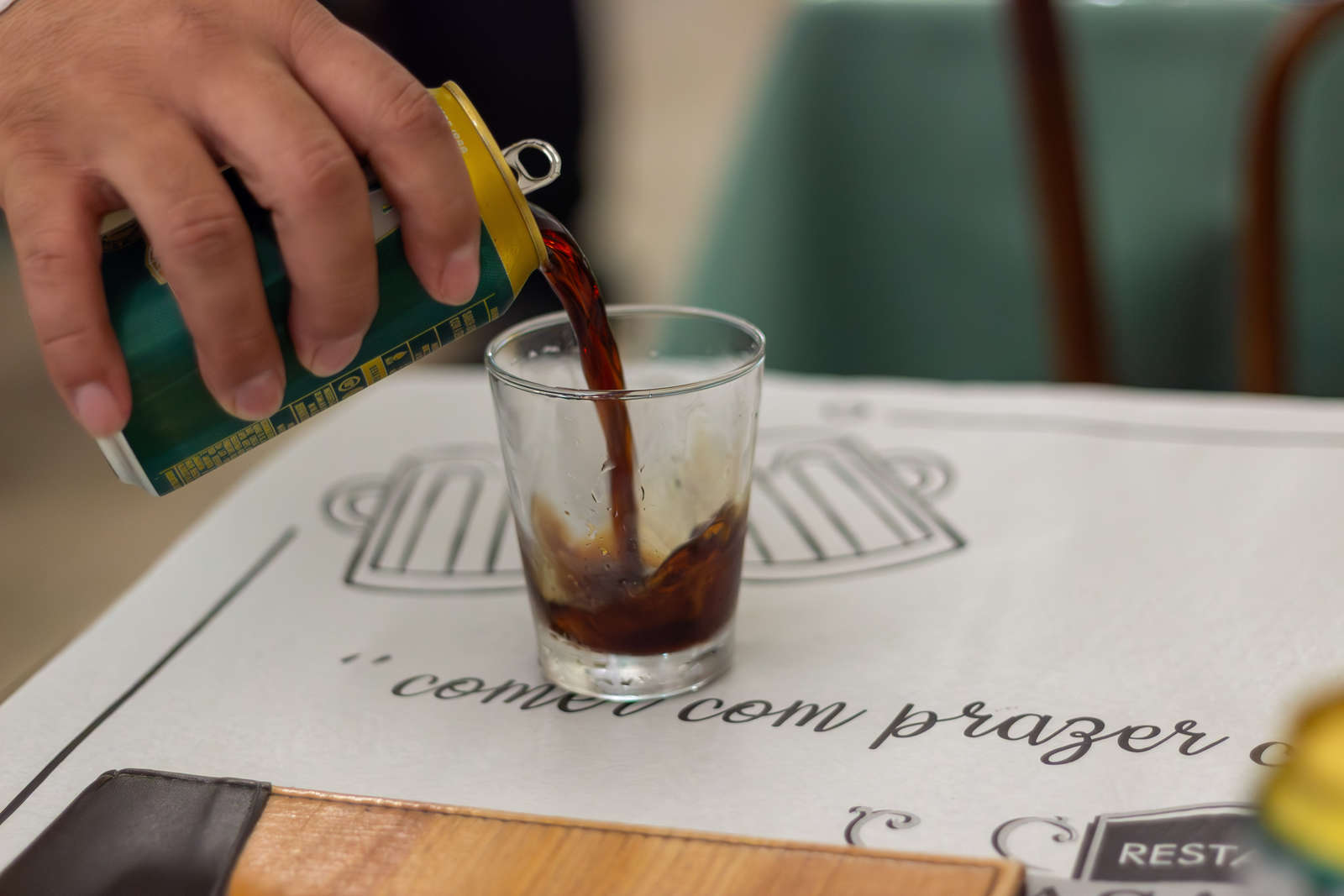 Dark beer being poured to accompany a starter at Casa Urich