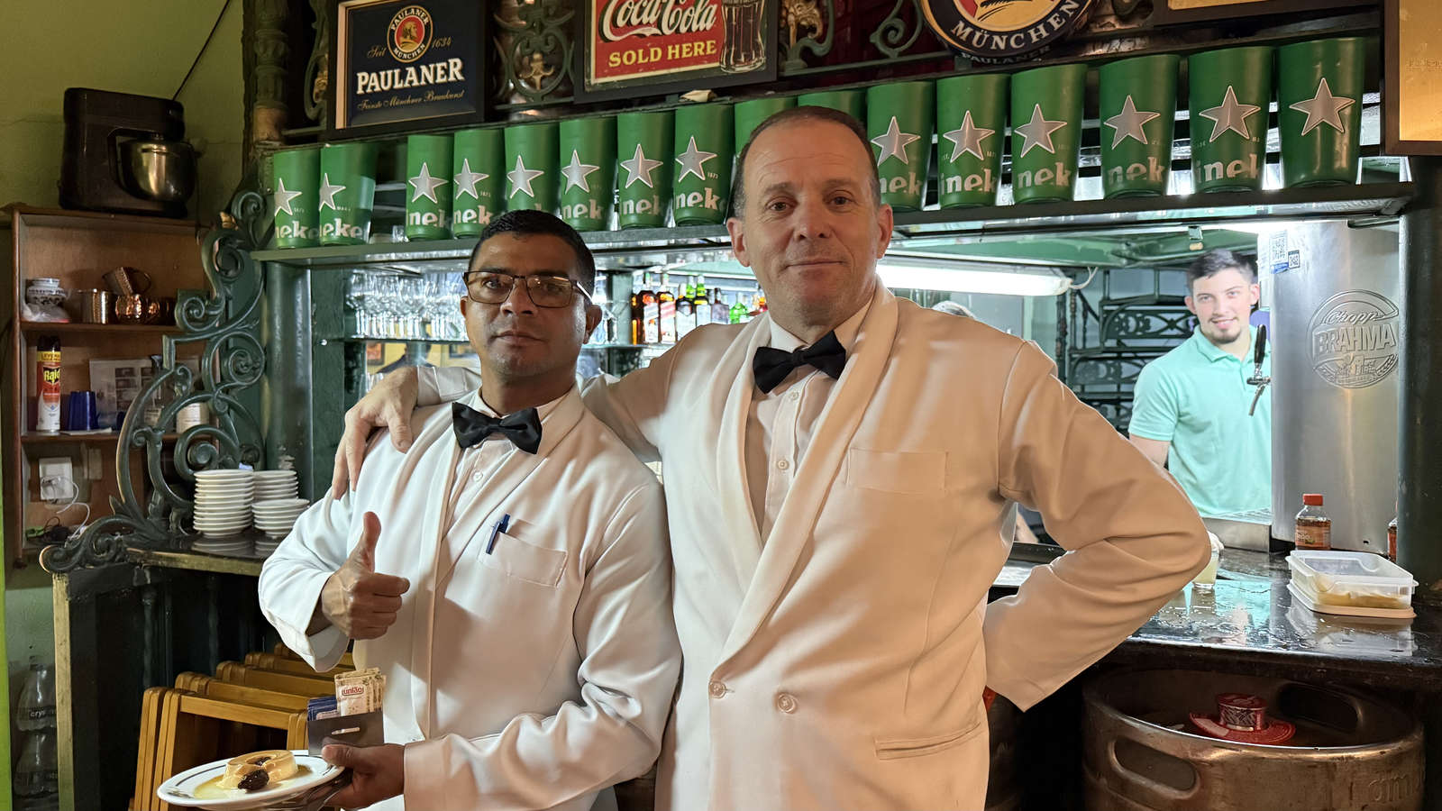 Casa Urich waiters beside the restaurant bar