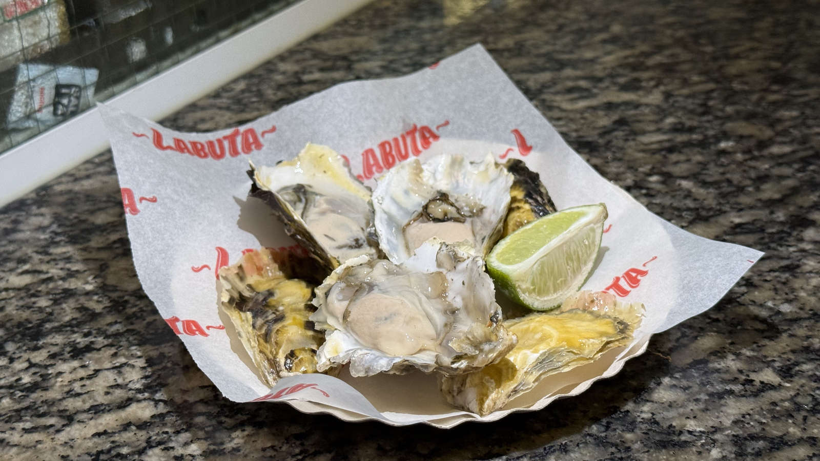 Three oysters with lime at Labuta Bar