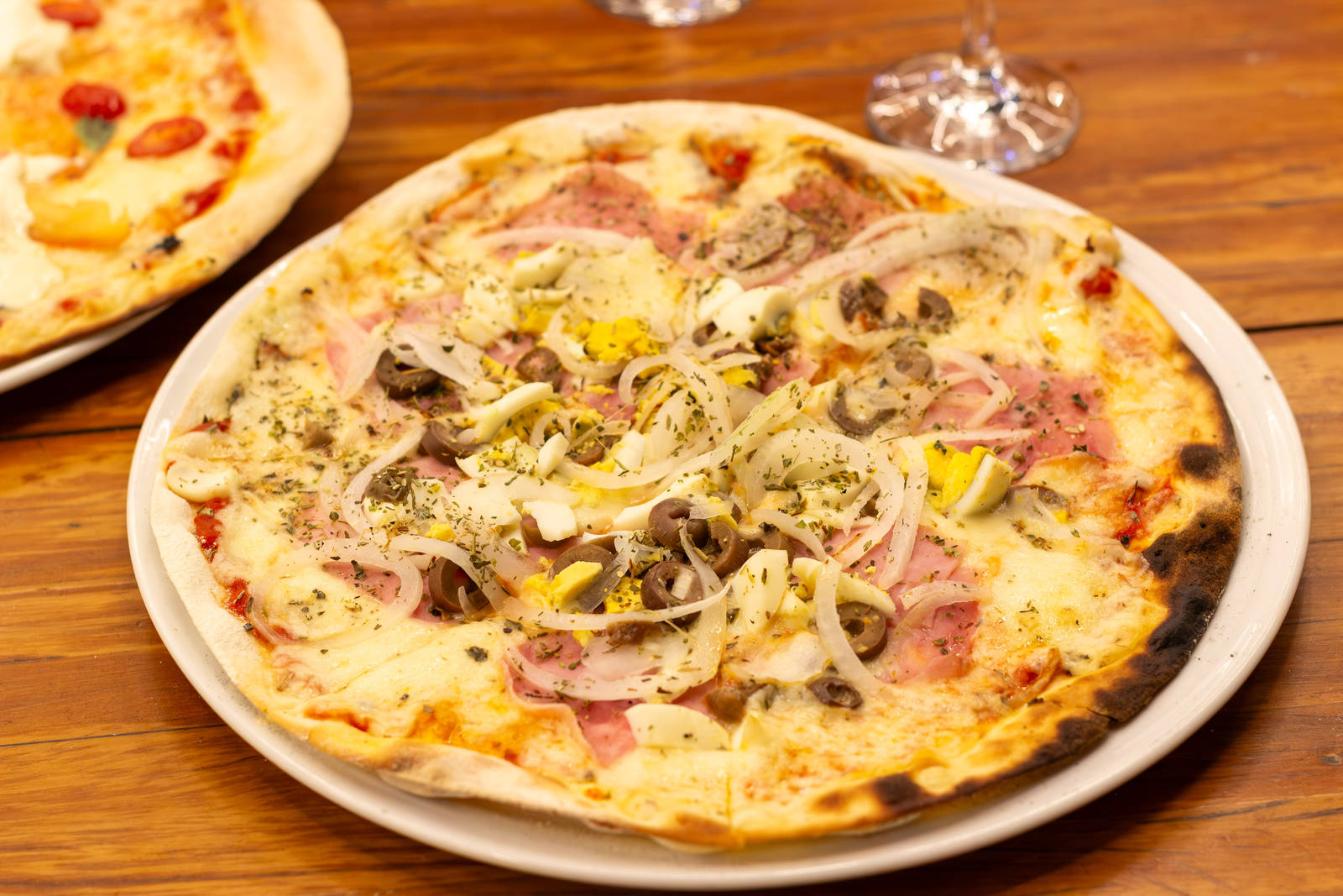 Portuguesa pizza with ham, egg, olives, and onion at Zona Sul