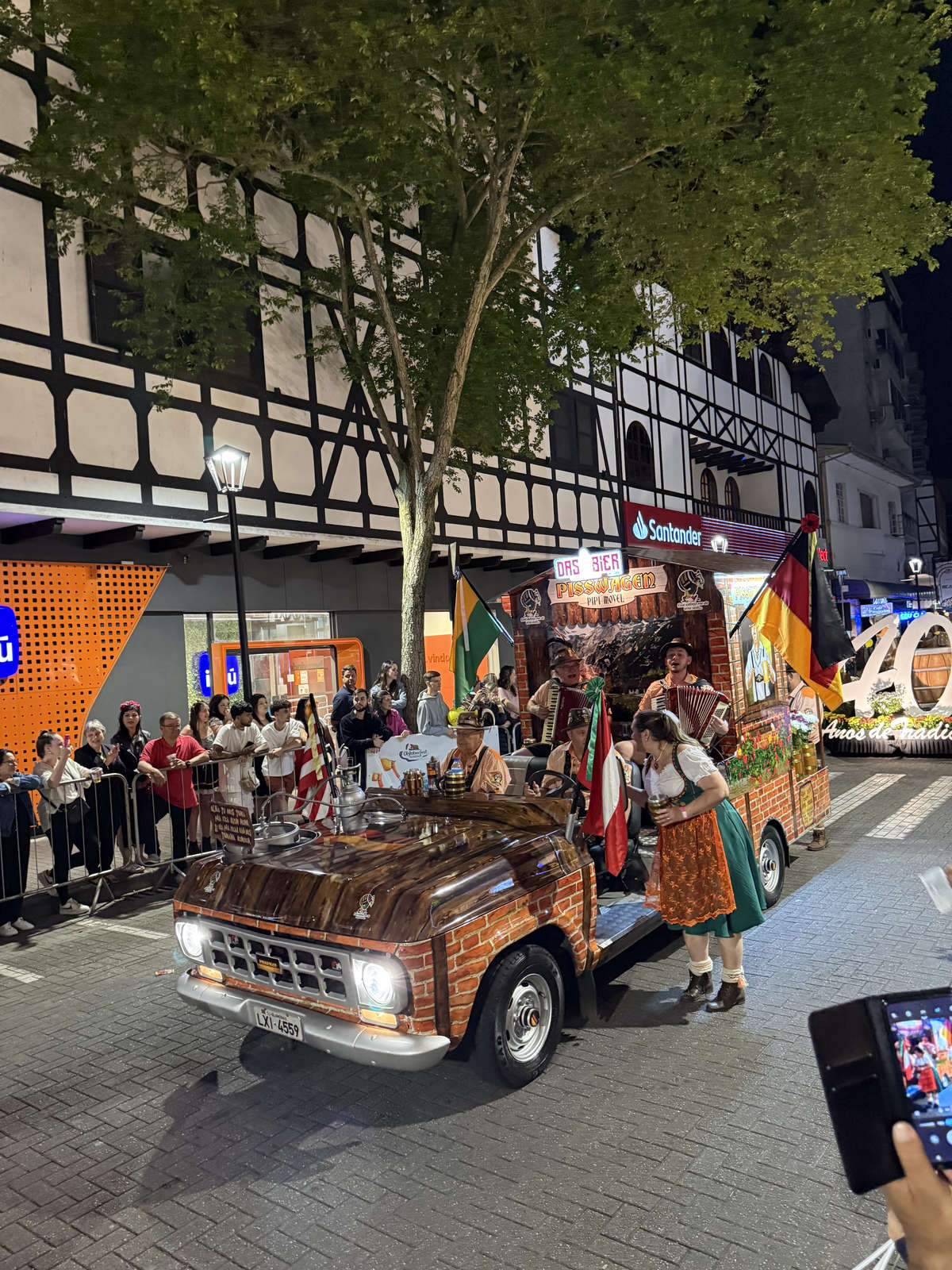 Musicians on the themed Pisswagen vehicle in the Oktoberfest Blumenau parade