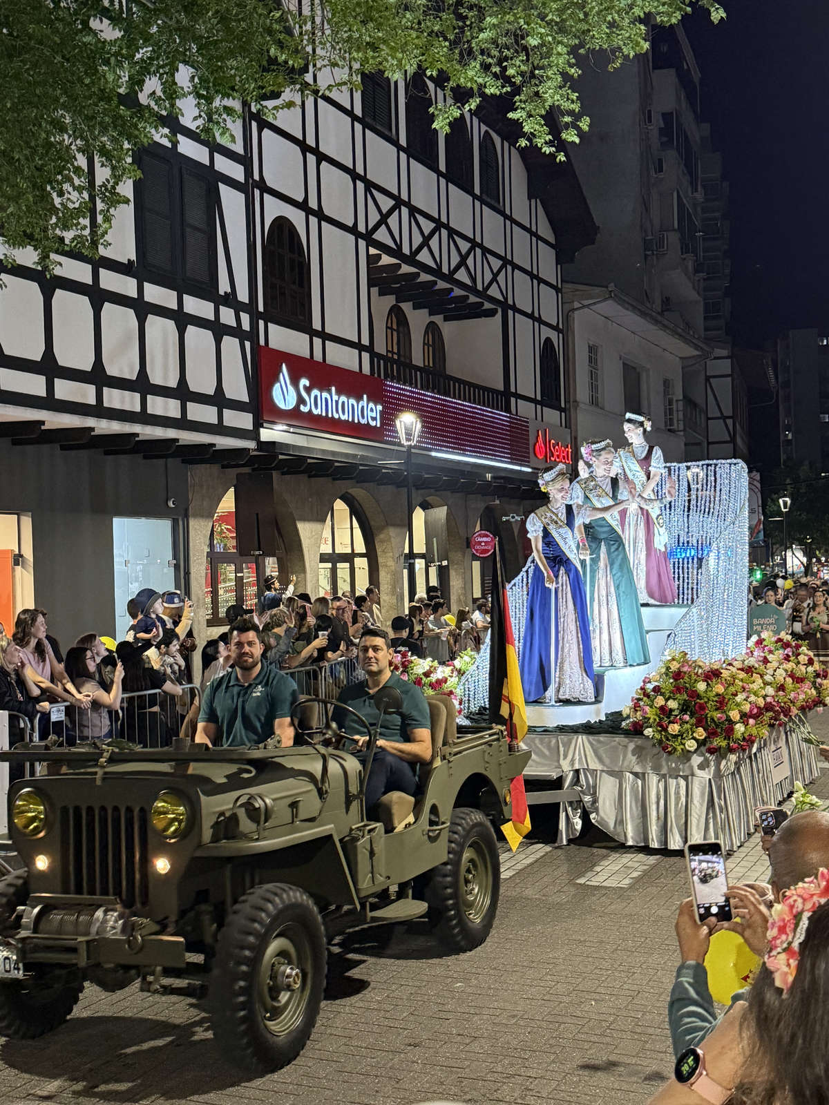 The Oktoberfest Blumenau queen and princesses riding a parade float